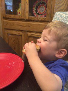 My then 1.5 year old devouring a greasy ole burger with conviction! 