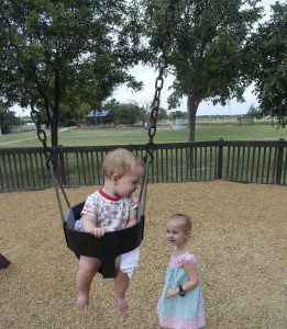 kids swinging in the park