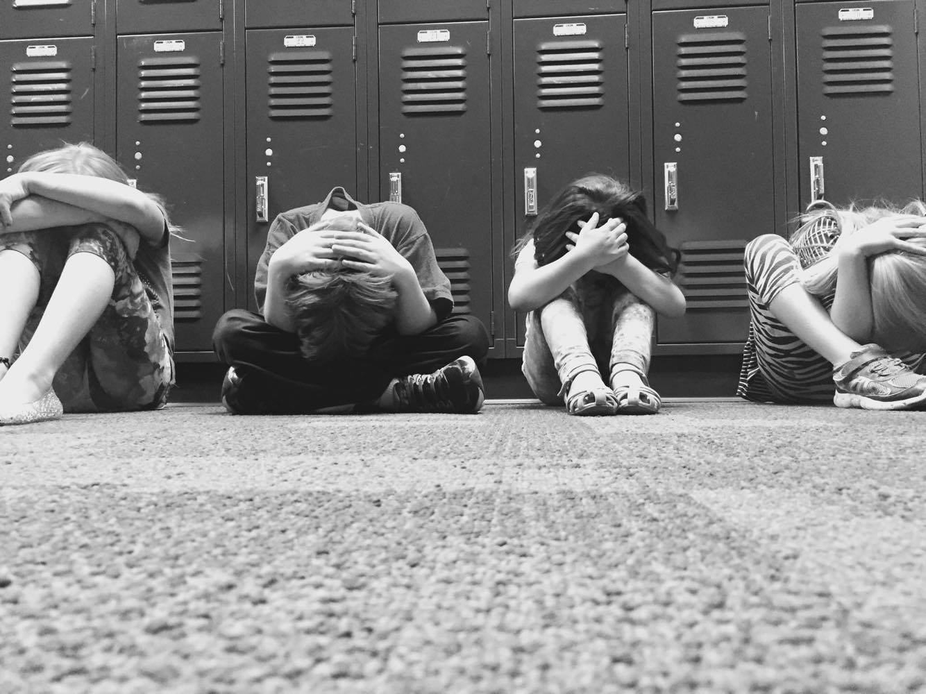 Kids crouching at school