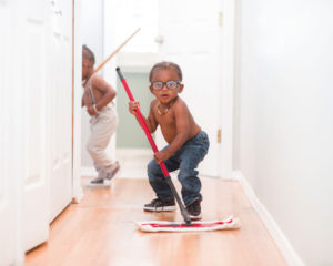 boys mopping floor for chores