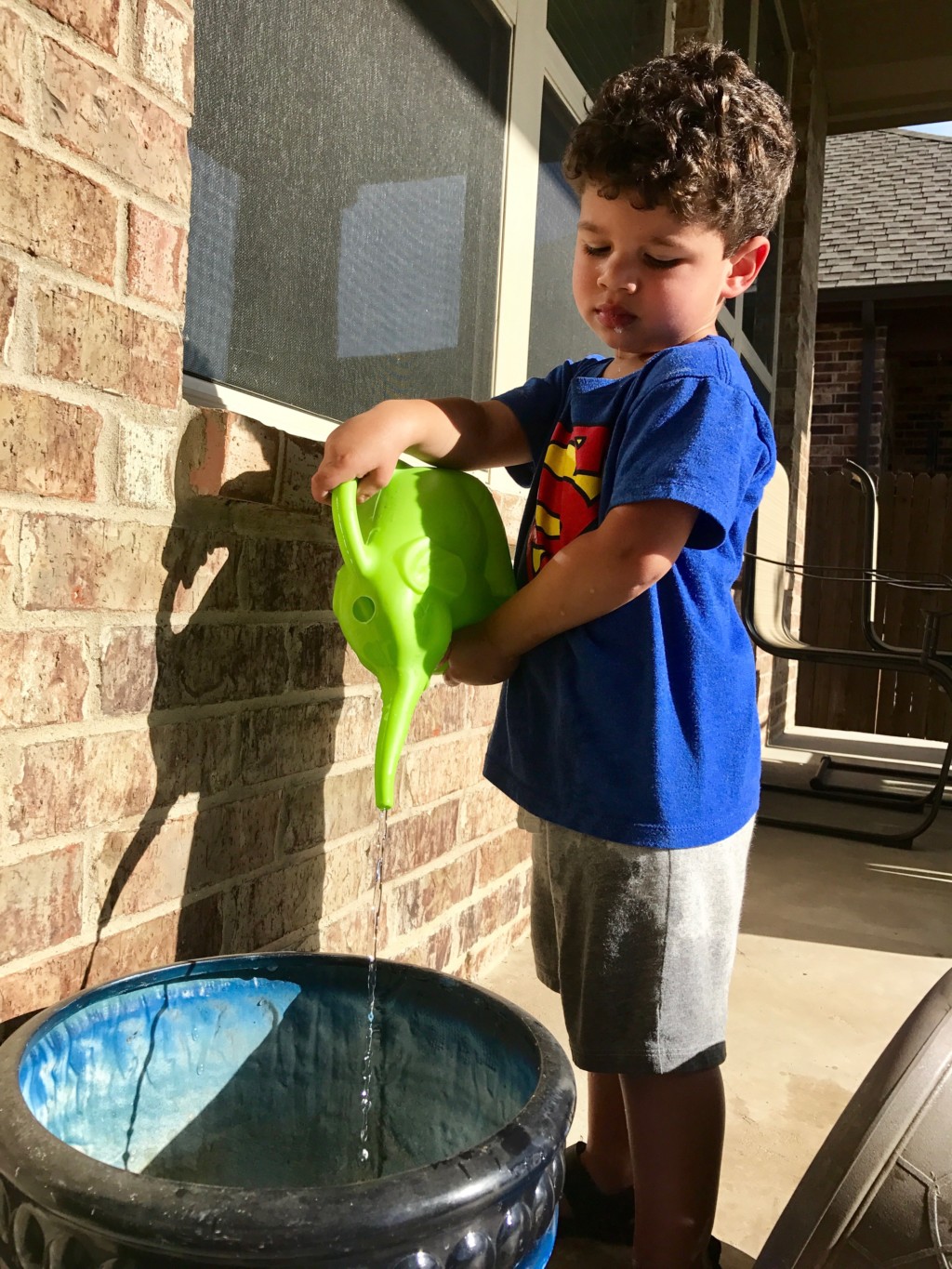 boy with a watering can