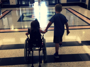 wheelchair-holding-hands