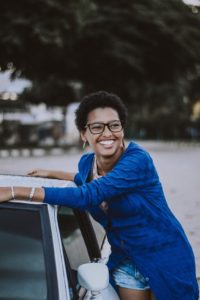 woman smiling by car