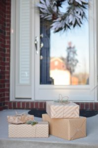 wrapped gifts on front porch
