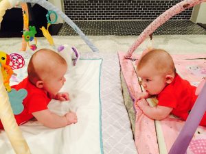 twins doing tummy time