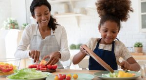 Let kids help prepare food to encourage nutritious eating habits.