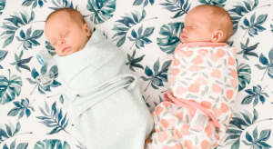 twin babies swaddled to sleep