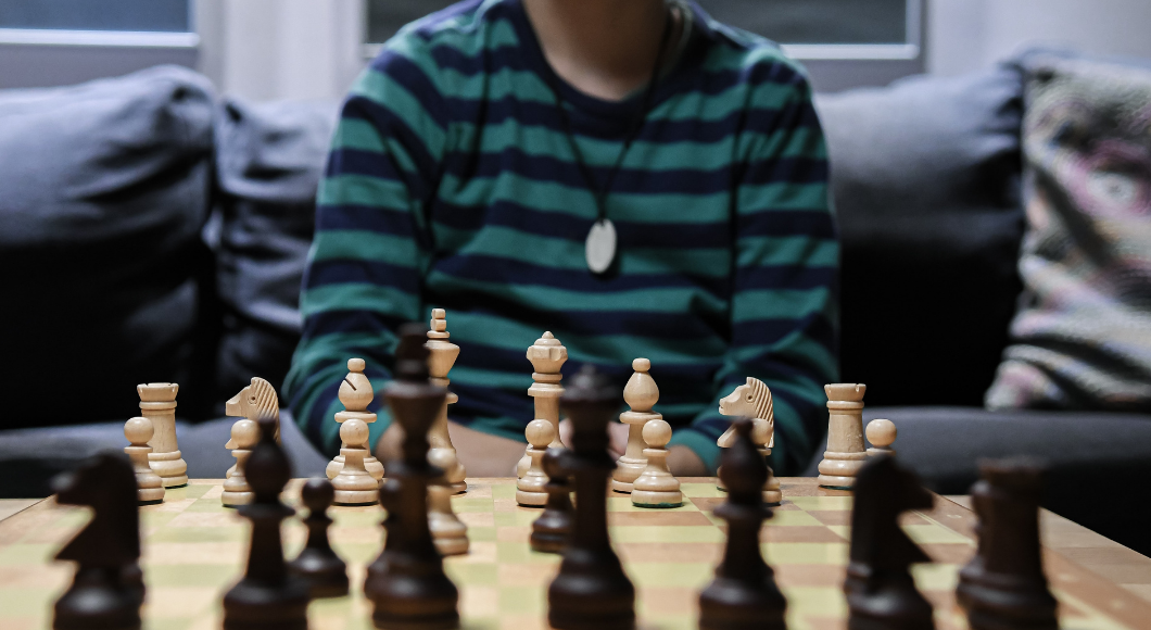 Teach a kid to play the game of chess.