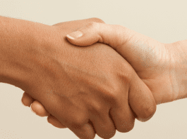 Parents shake hands to agree on school tasks
