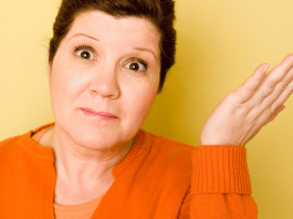 Older woman shrugs her shoulder about parenting young adults