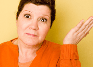 Older woman shrugs her shoulder about parenting young adults