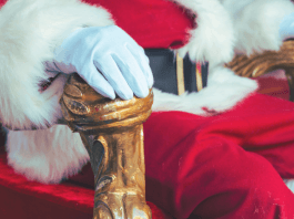 close-up of Santa sitting on a fancy chair
