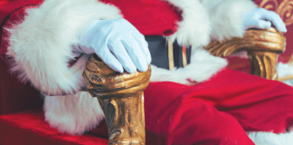close-up of Santa sitting on a fancy chair