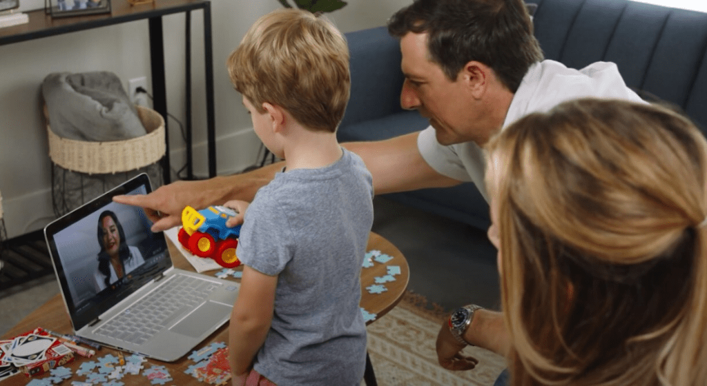 A family and son meet with a telehealth provider virtually to help diagnose autism.