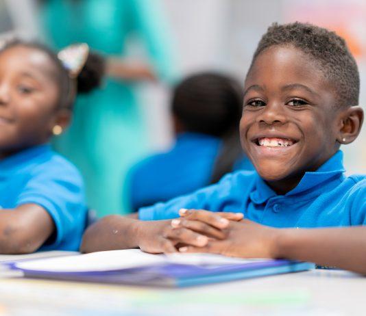 African-american boy and girl in elementary school doing classwork at Idea Public Schools