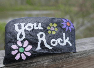 A rock painted with the words "You Rock."
