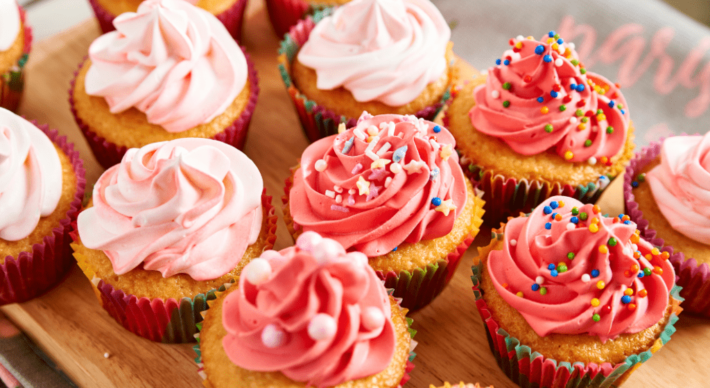 Gourmet cupcakes decorated with pink frosting and sprinkles make a sweet treat for teacher appreciation week