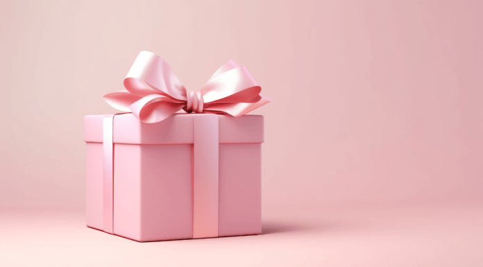 A gift wrapped in pink with a big pink bow.